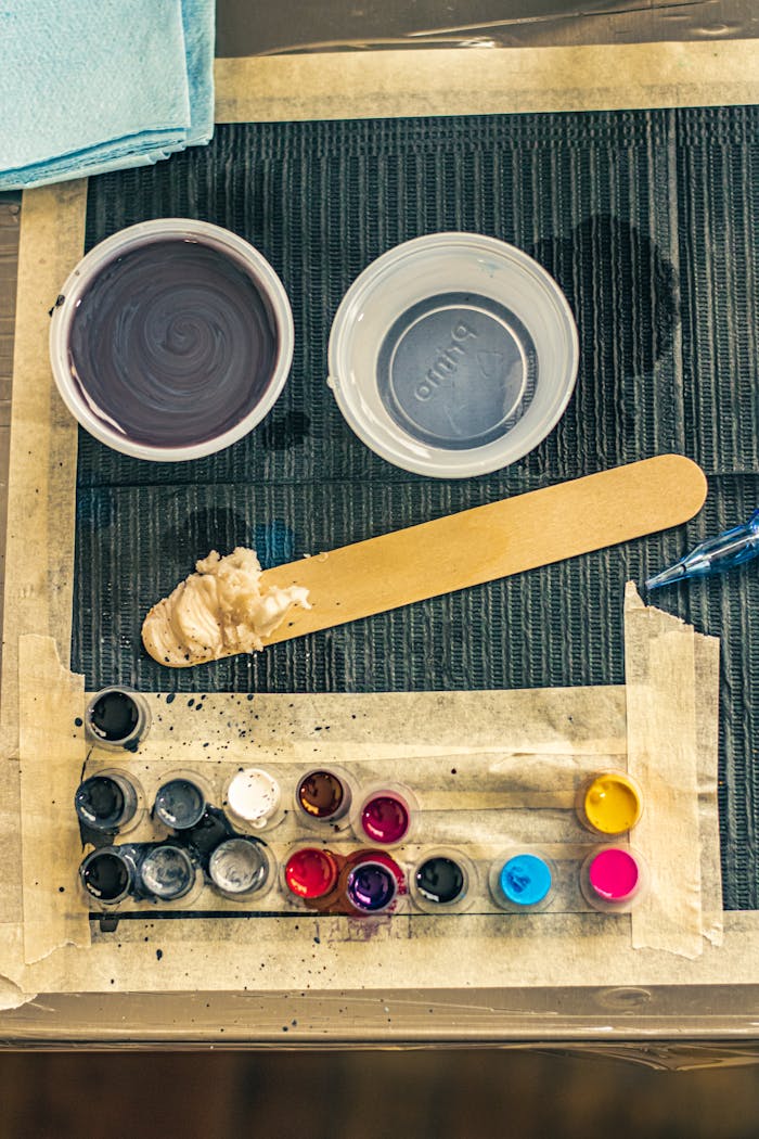 ours-journey Close-up of tattoo ink containers and tools in a studio setting, Ciudad de México.